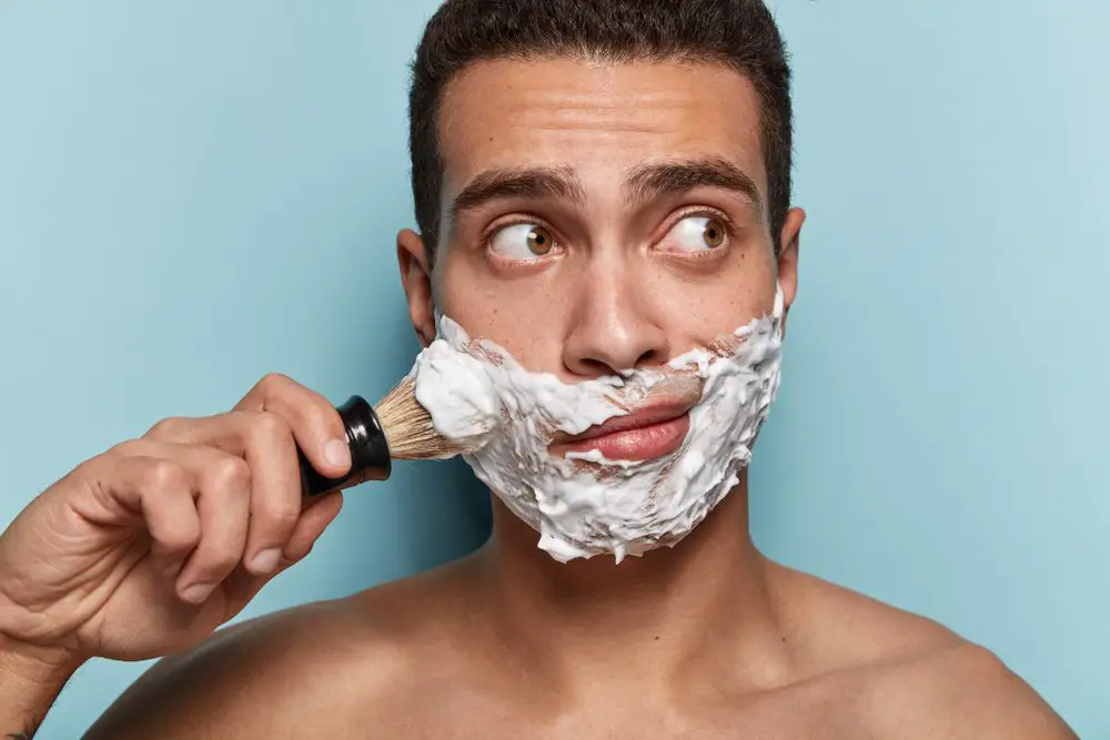 man shaving lather