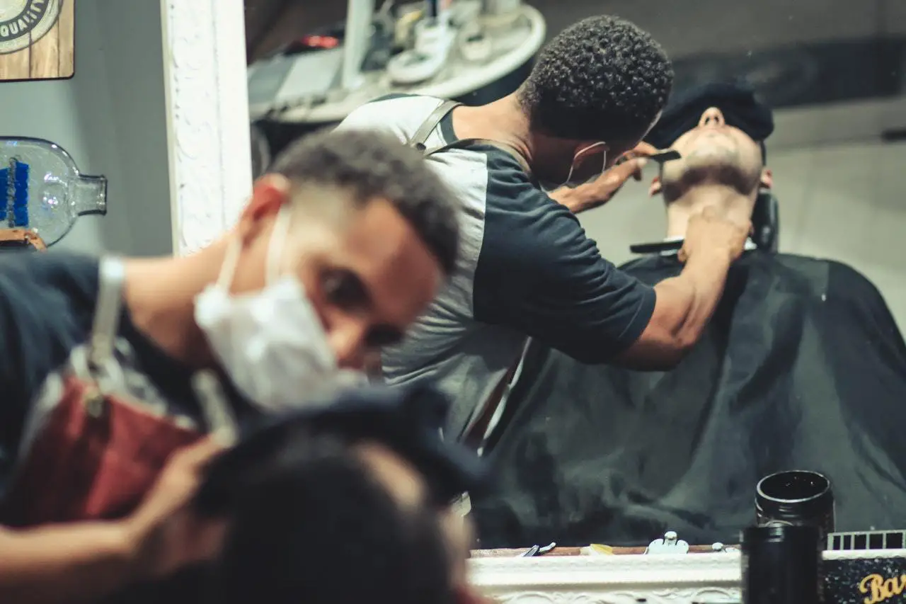 a barber shaving a beard/How Many Shaves Per Blade